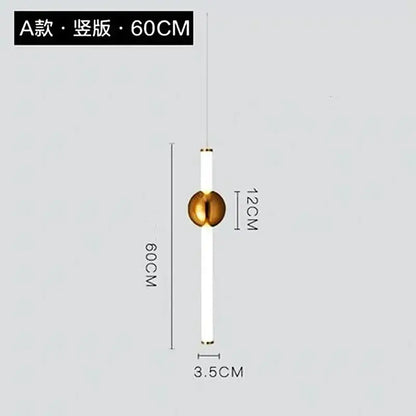 A modern pendant light with a white cylindrical body and gold spherical accent featuring a geometric line frame design