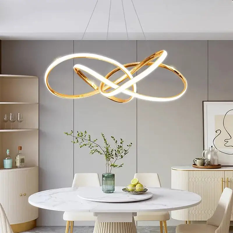 Modern gold geometric line led chandelier featuring an infinity-loop pendant light with illuminated LED rings for dining room decorbites geometric line