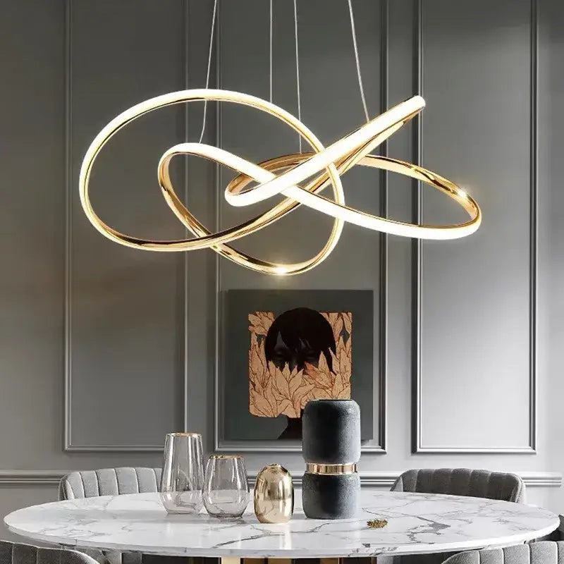 Modern gold geometric line led chandelier with intertwined circular rings for dining room decorbites geometric line lighting