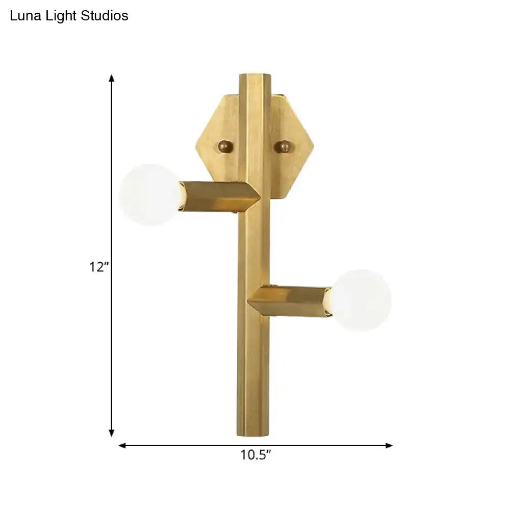 Modern gold geometric wall light with brass finish, hexagonal backplate, direct wired electric vertical tube corner design