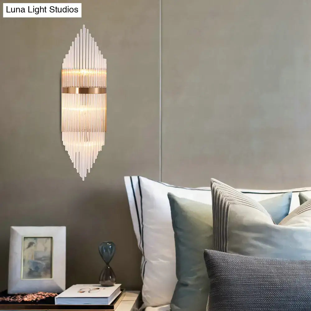 Modern gold geometric wall sconce with clear glass vertical rods and metallic bands for living room fixture height