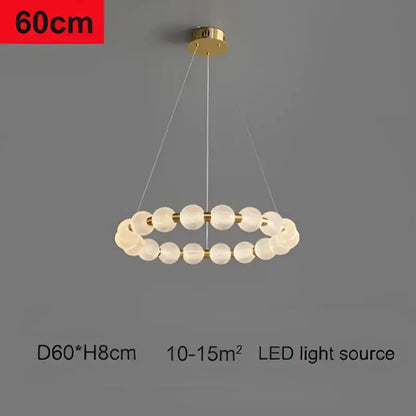 Modern gold glass ball led ceiling chandelier features gold finish and translucent textured glass spheres for living room decorbites decor