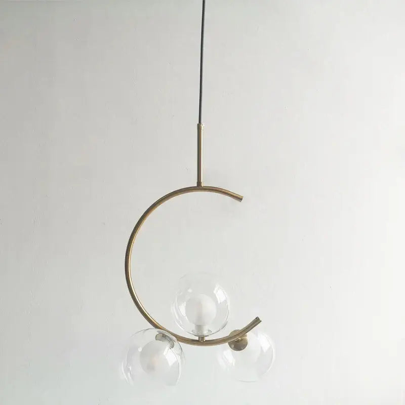 Modern gold glass ball led chandelier featuring a minimalist brass crescent pendant with three clear glass globes decorbites glass ball