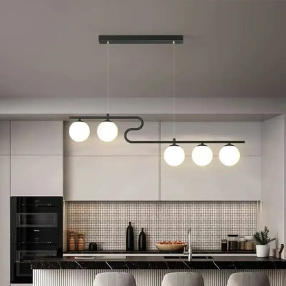 Modern black metal pendant light with four glowing white glass ball led bulbs for decorbites glass ball chandelier design