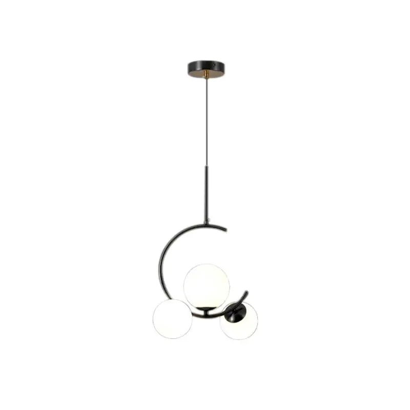 Modern black metal pendant light with three frosted glass spheres in a decorbites glass ball led chandelier style