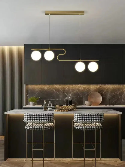 Modern gold glass ball led chandelier with three spherical bulbs and curved metal frame for dining room decorbites glass ball