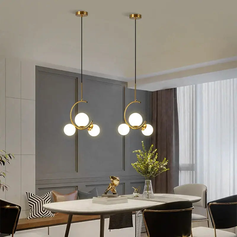 Modern gold glass ball led chandelier features gold-toned circular frames with multiple spherical bulbs for dining room decorbites glass ball pendant light