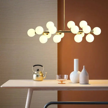 Modern gold glass ball led chandelier with frosted spherical bulbs in a branching design for dining room decorbites glass ball
