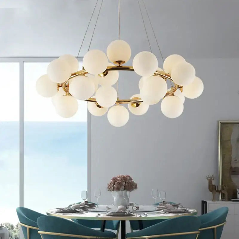 Modern gold glass ball led chandelier featuring frosted white spherical globes in a circular cluster for dining room decorbites glass ball