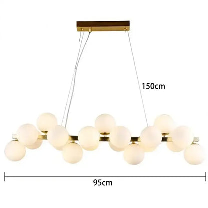 A modern gold pendant light featuring frosted glass ball led bulbs in an asymmetrical decorbites glass ball design
