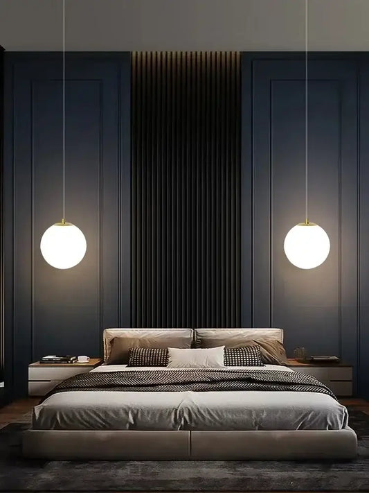 Modern gold glass ball led pendant chandelier with warm white glow and gold-toned decorbites glass ball fixtures above bed
