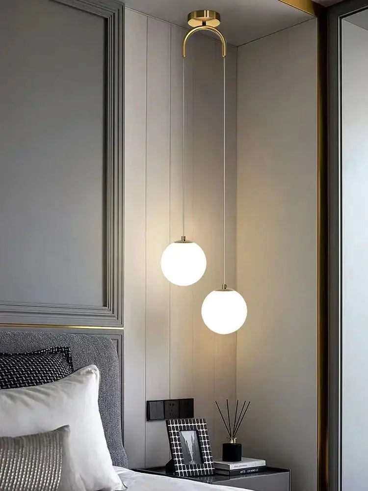 Two frosted glass ball led pendant chandeliers with polished gold fixtures for modern bedroom decorbites lighting