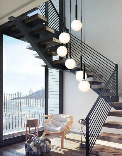 Modern gold glass ball led pendant light with spherical white glass globes suspended by black cords for decorbites pendant light