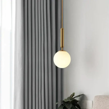 Modern gold glass ball led pendant light with frosted glass globe and sleek metal rod ideal for bedroom decorbites pendant light