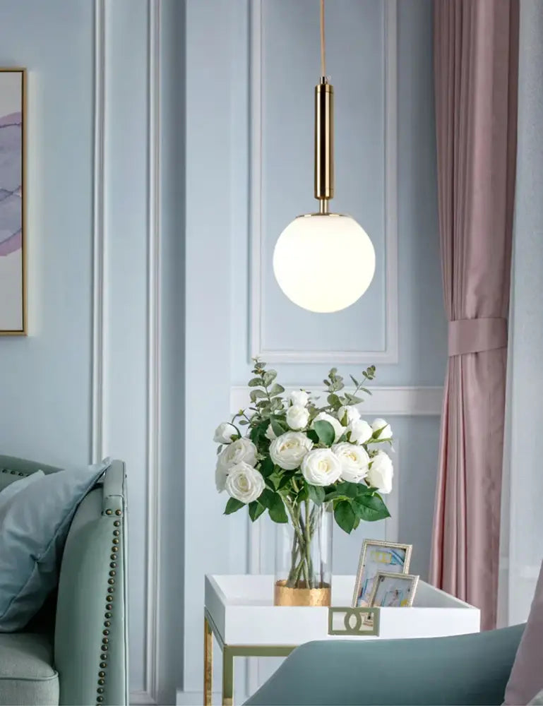 Modern gold glass ball led pendant light with sleek gold metal rod and frosted glass globe for stylish decorbites decor