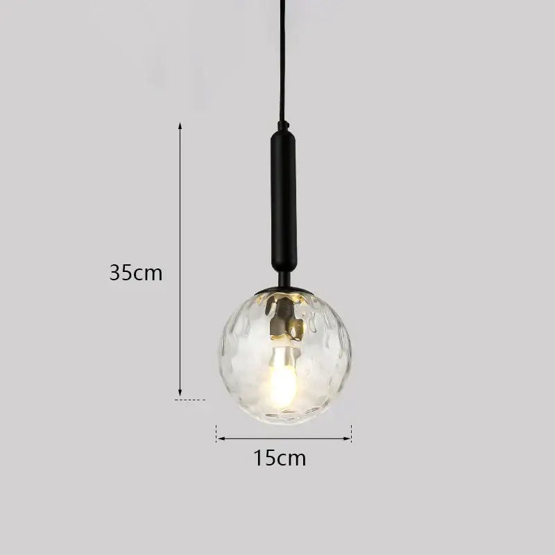 Modern gold decorbites glass ball led pendant light with textured clear glass globe and black metal rod for bedroom decor