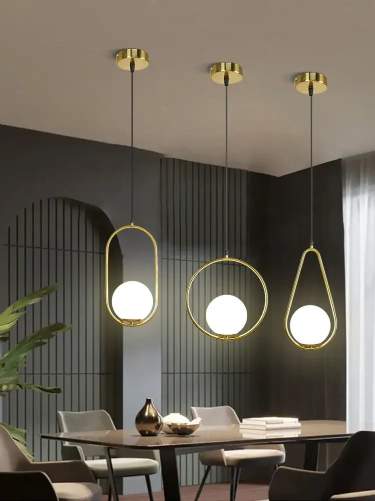 Modern gold glass ball led pendant light with sleek oval and circular frames for dining room decorbites pendant light