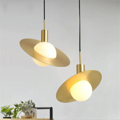 Two modern gold glass ball led pendant lights with metal shades and warm glow for dining room decorbites pendant light decor