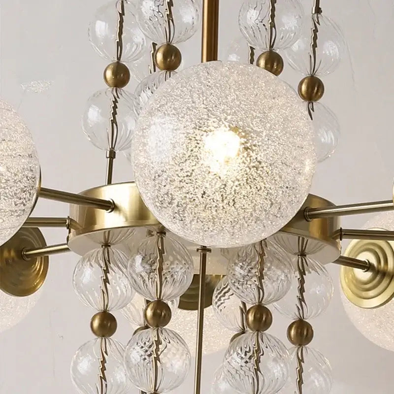 Modern gold glass ball led pendant light featuring a brass fixture with clear glass spheres for kitchen island decorbites pendant light