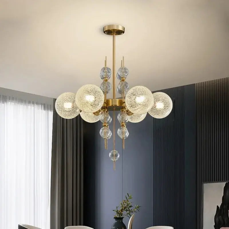 Modern gold glass ball led pendant light featuring textured glass spheres in various sizes for kitchen island decorbites pendant light