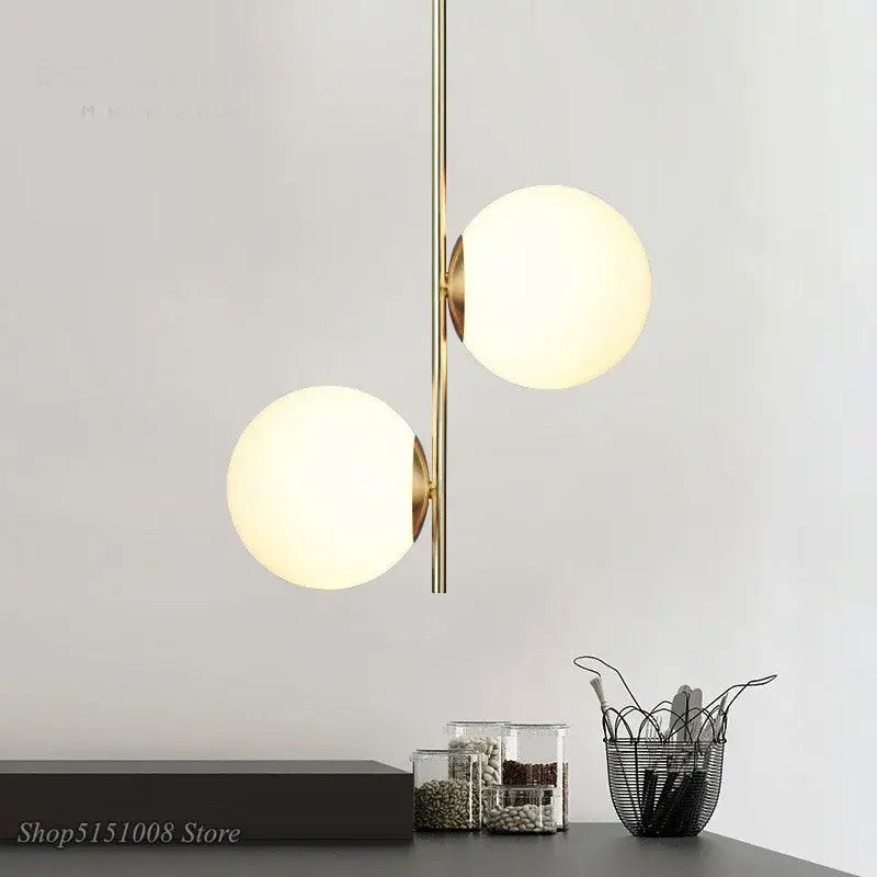 Modern brass-finished pendant light with two frosted glass globe shades for decorbites glass ball led lighting