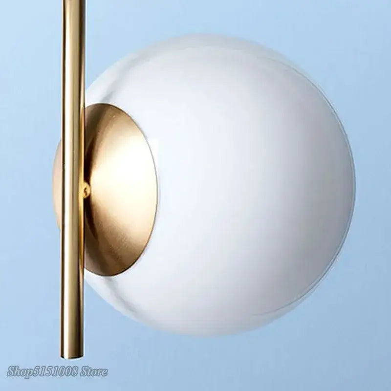 Modern gold glass ball led pendant light with sleek gold metal rod and frosted white glass globe for living room decorbites glass ball