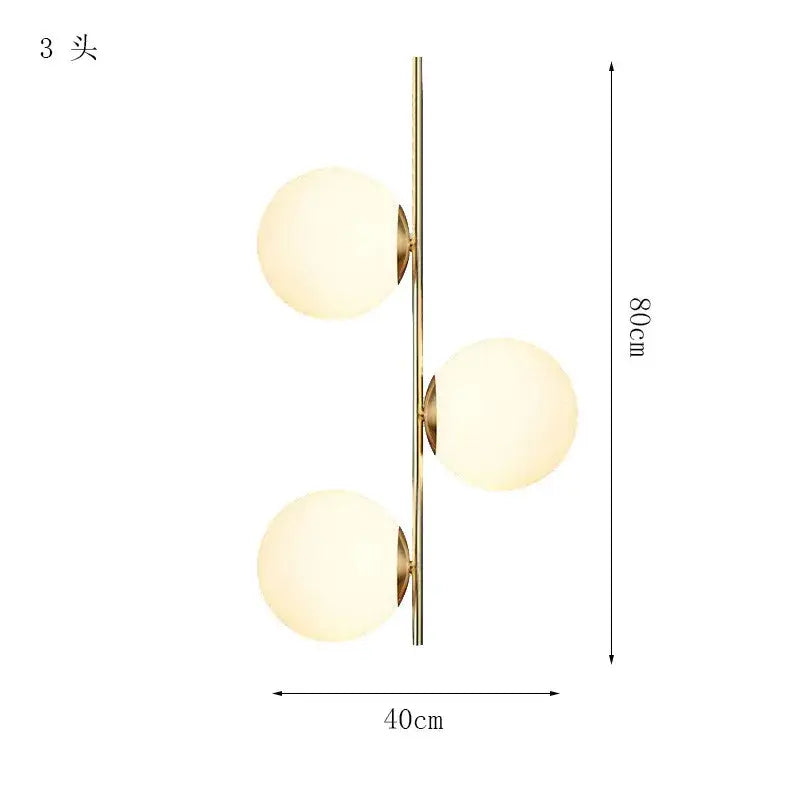 Modern gold glass ball led pendant light featuring a gold-toned wall sconce with three frosted glass globe shades decorbites glass ball