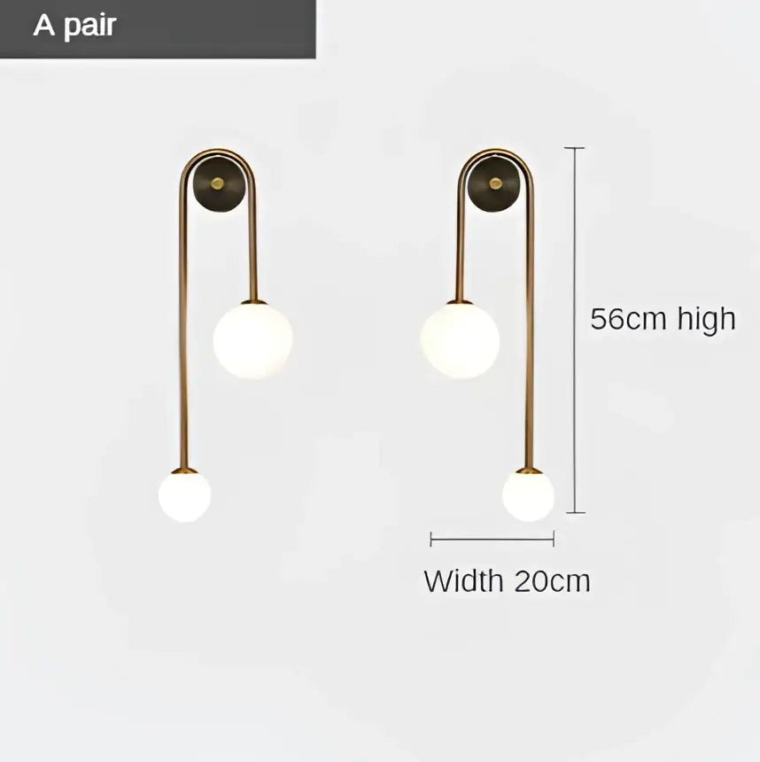 Brass-finished modern wall lamp with two white glass ball LED globes for bedroom and study decorbites glass ball