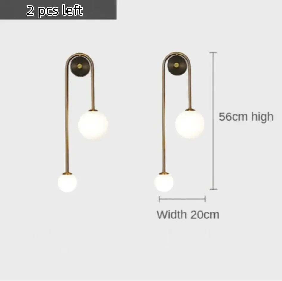 Brass-finished modern gold glass ball led wall lamp with two frosted glass globe lights for bedroom and study decorbites wall lamp
