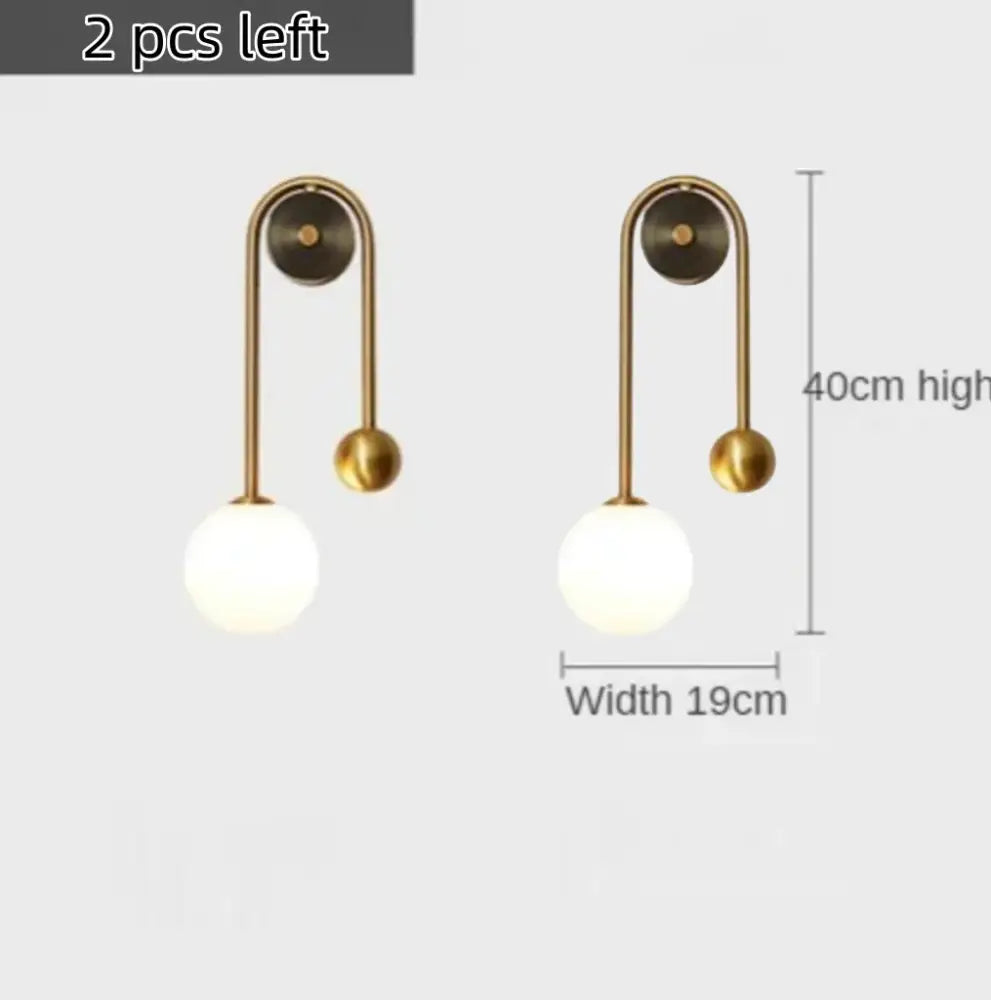 Modern gold wall lamp with curved arm and frosted glass ball led shade for bedroom and study decorbites glass ball