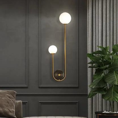 Modern gold glass ball led wall lamp with two frosted globes and curved metallic arm for bedroom and study decorbites wall lamp