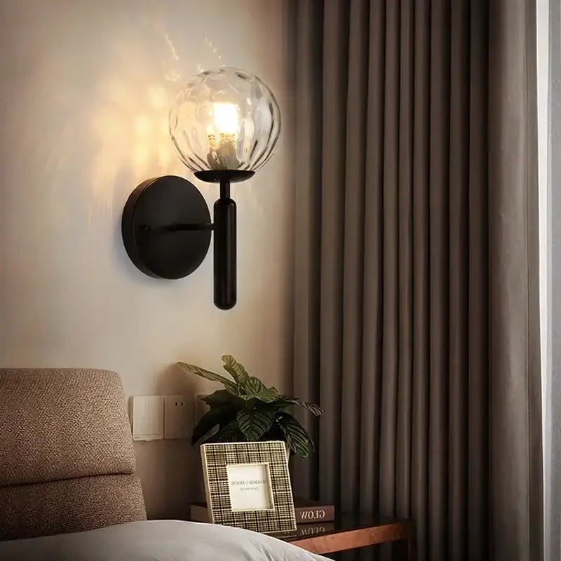 Black wall lamp with textured glass globe shade featuring decorbites glass ball led design for modern bedroom decor