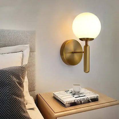 Modern gold glass ball led wall lamp with frosted glass globe for bedroom featuring decorbites glass ball design