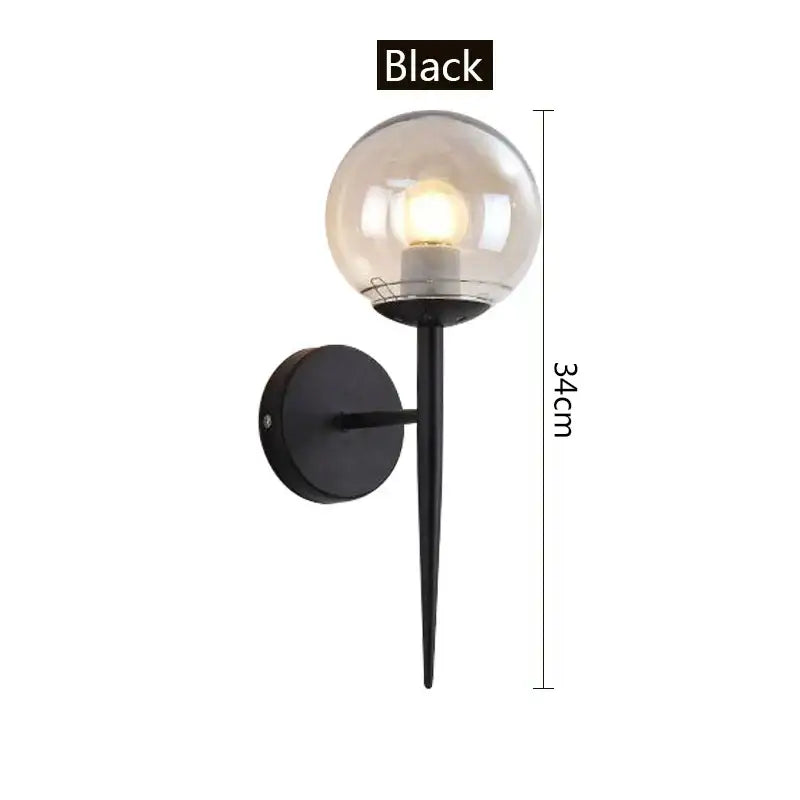 Modern gold decorbites glass ball led wall lights featuring a black spherical glass globe on a slender metal stem