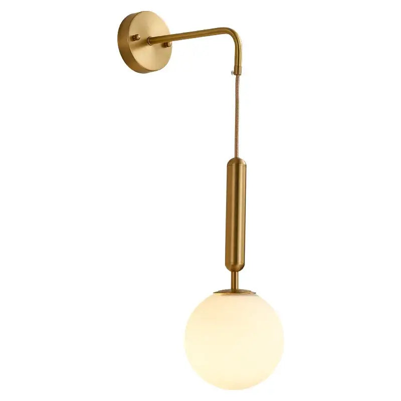 Modern gold-toned wall sconce with sleek curved arm and frosted decorbites glass ball led shade for bedroom decor