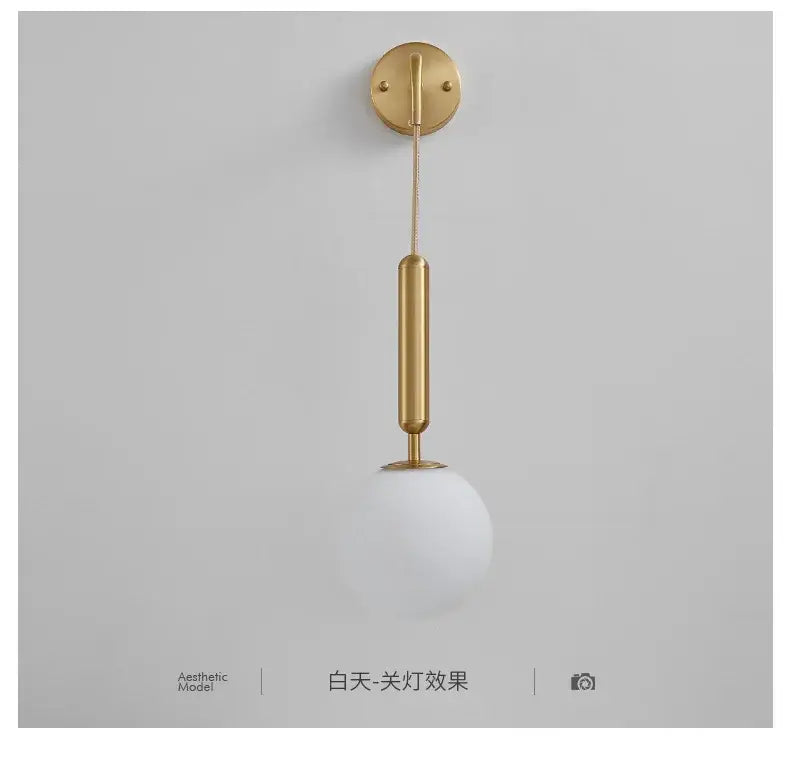 Modern gold glass ball led wall sconce with a sleek cylindrical stem and frosted white shade for bedroom decorbites decor