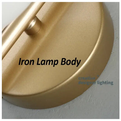 Modern gold glass ball led wall sconce with gold-finished iron lamp body and sleek curved design for living room decorbites glass ball lighting