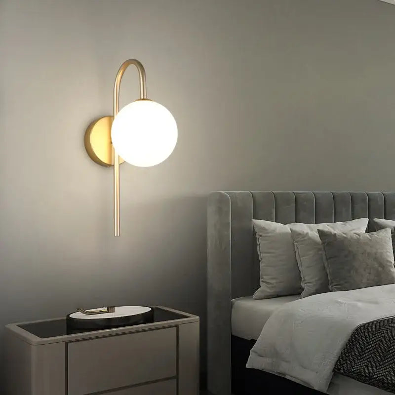 Modern gold wall sconce with curved arm and frosted glass ball led shade for living room decorbites glass ball lighting
