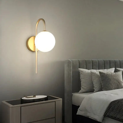 Modern gold wall sconce with curved arm and frosted glass ball led shade for living room decorbites glass ball lighting