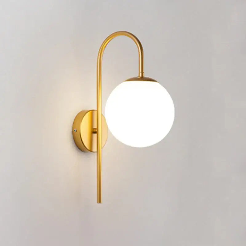 Modern gold glass ball led wall sconce with curved arm and frosted globe shade for living room decorbites lighting