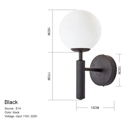 Black wall sconce with frosted glass globe and matte black metal base for modern decorbites glass ball mirror wall lights