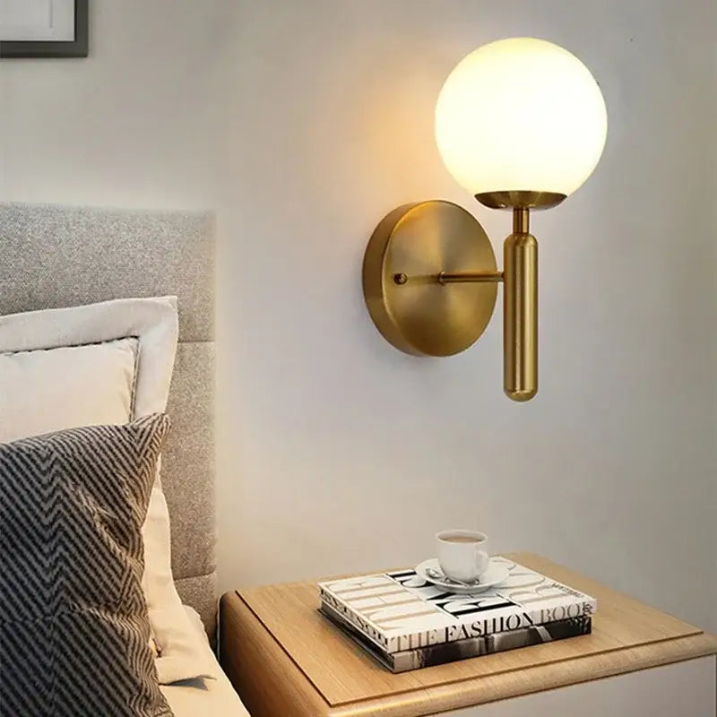 Brass-finished wall sconce with frosted glass globe decorbites glass ball pendant for modern dining room lighting