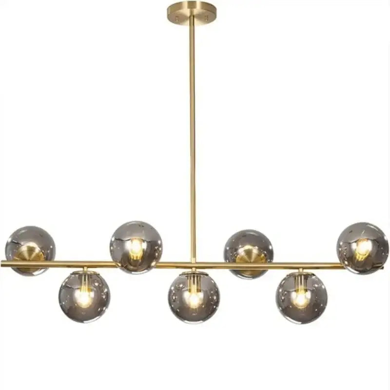 Modern gold ball pendant chandelier with seven smoked glass globe shades ideal for dining room decorbites glass ball