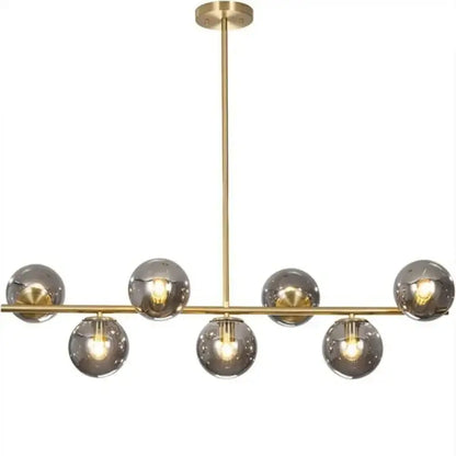 Modern gold ball pendant chandelier with seven smoked glass globe shades ideal for dining room decorbites glass ball