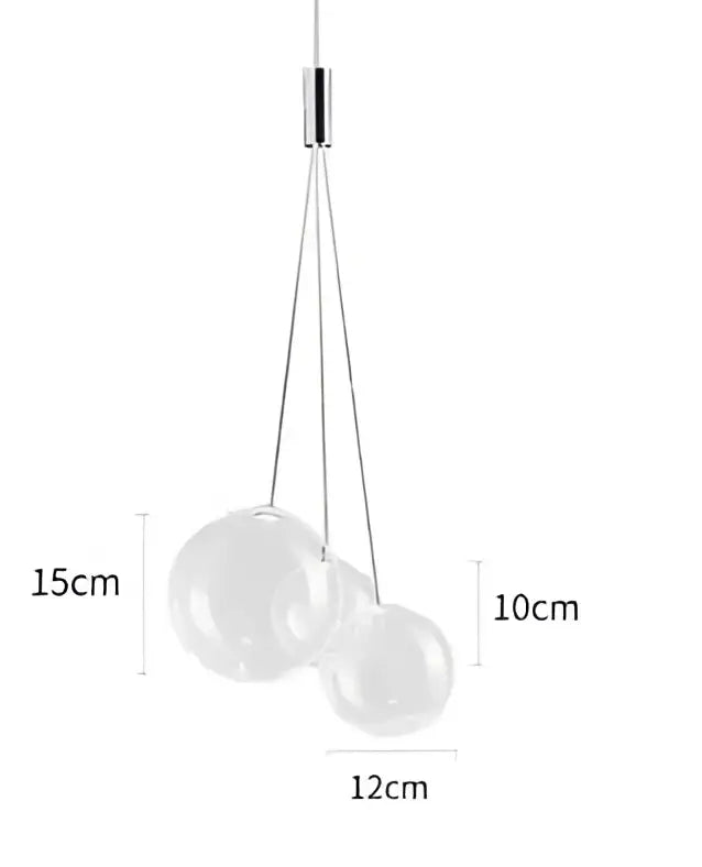 Modern gold glass ball pendant chandelier with three clear glass spheres suspended by thin metallic cords