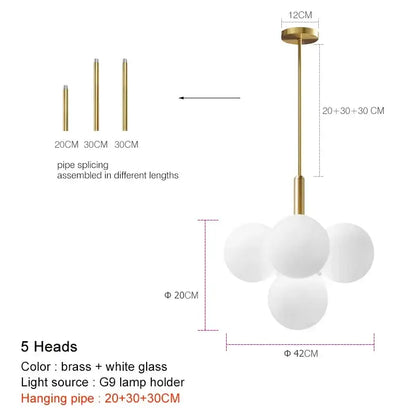 Modern brass-finished glass ball pendant chandelier with five frosted white spheres for dining room decorbites glass ball