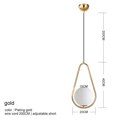 Modern gold glass ball pendant light with a gold-plated teardrop pendant and white glass globe by decorbites glass ball