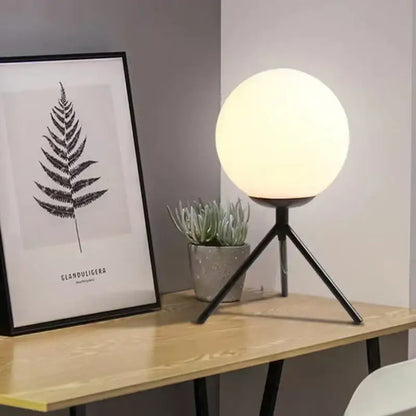 Modern glass ball table lamp with frosted white glass globe and black metal tripod base for bedroom decorbites decor