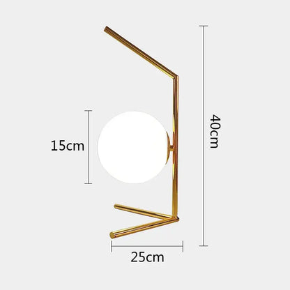 Modern gold glass ball table lamp features a gold-toned minimalist frame and frosted glass ball for elegant decorbites glass ball lighting