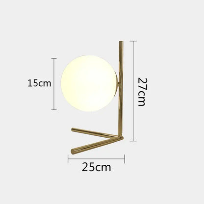 Modern gold glass ball table lamp with frosted globe shade and slender metal base ideal for bedroom decorbites decor